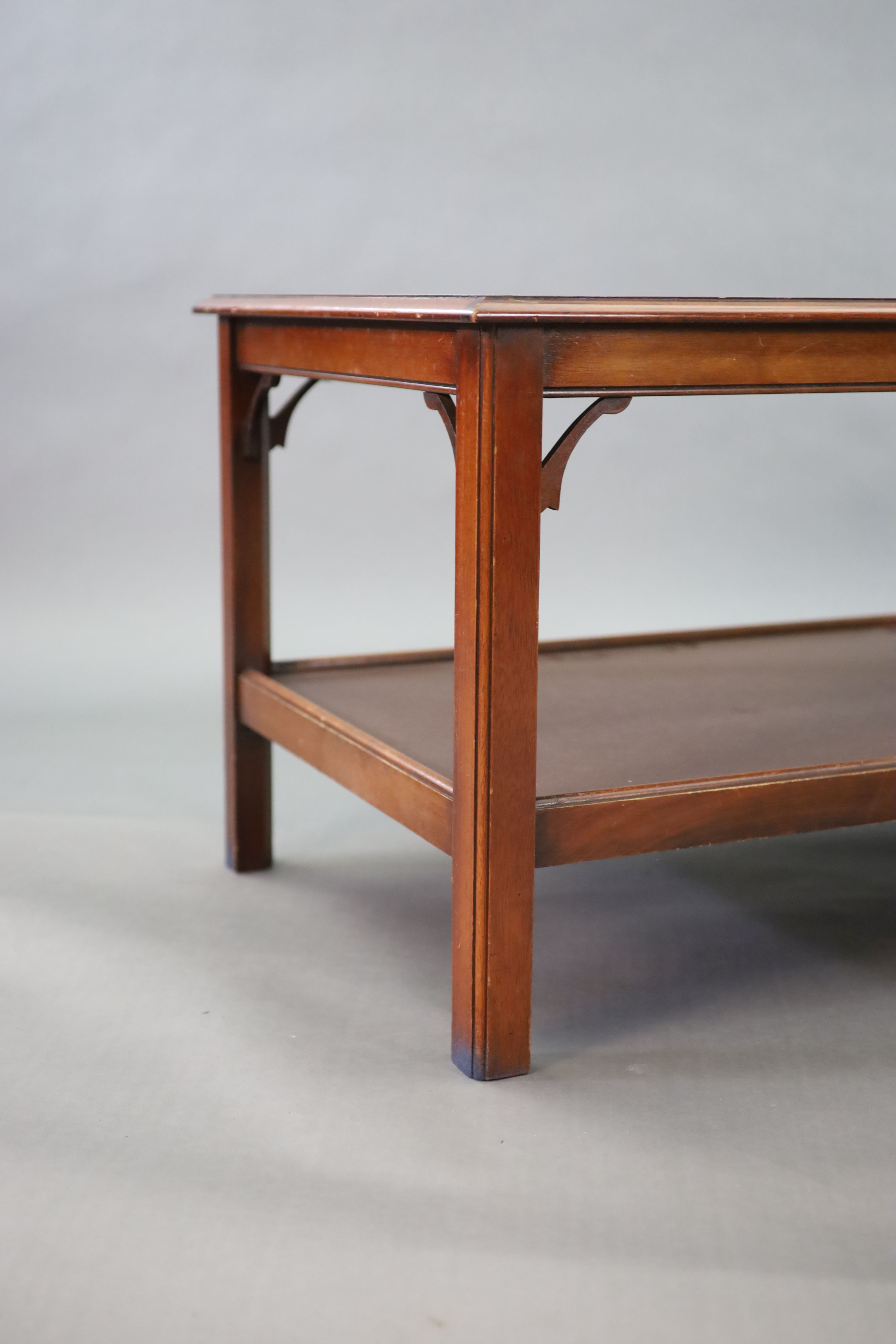 A mahogany two tier coffee table, 122 x 62cm width 122cm depth 62cm height 56cm